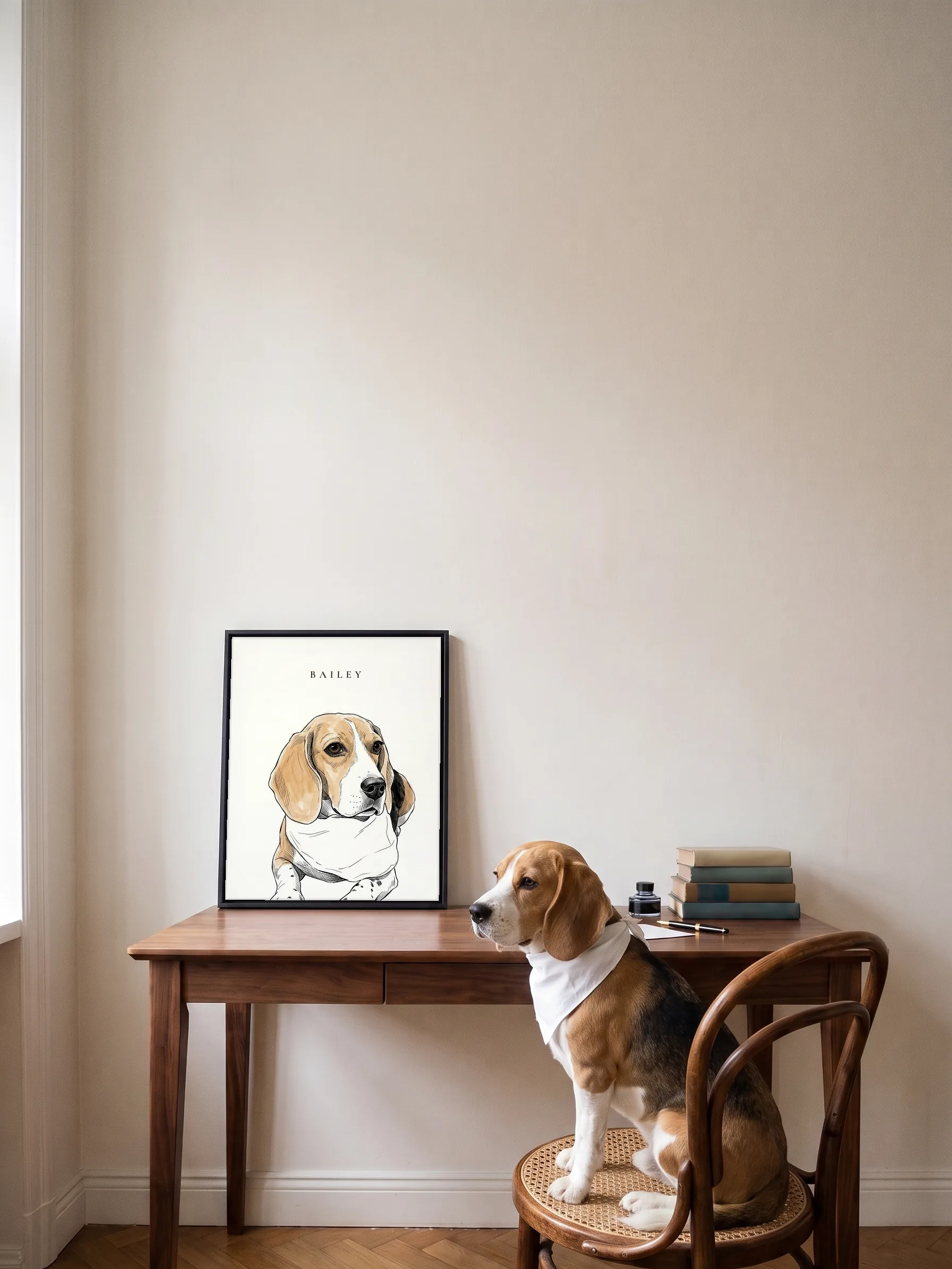 A beagle in a white bandana sitting on a bentwood chair, looking at its own ink portrait: a framed canvas on a walnut desk