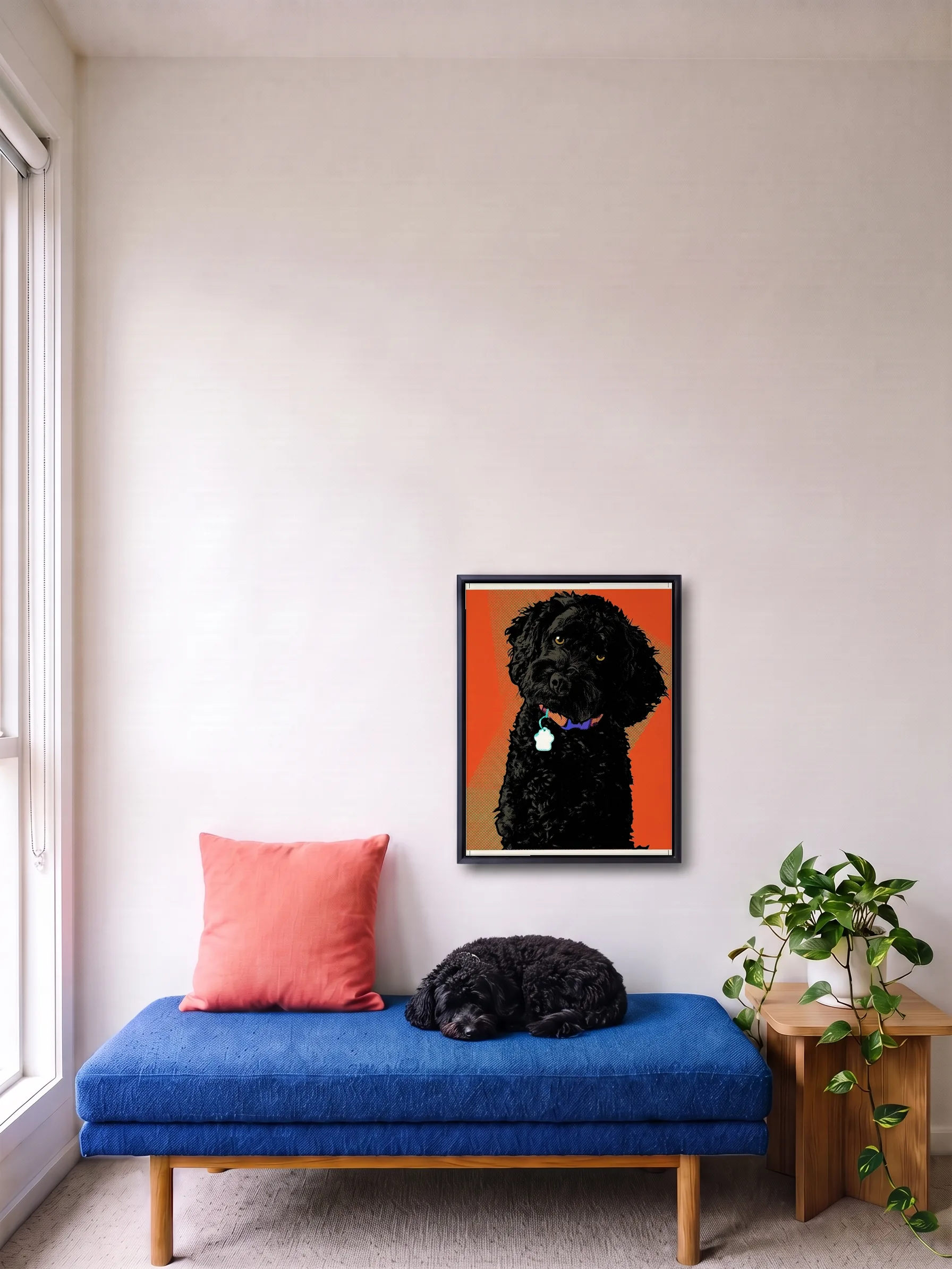 A small black poodle asleep on a blue daybed under its own pop art portrait, a framed canvas on the wall