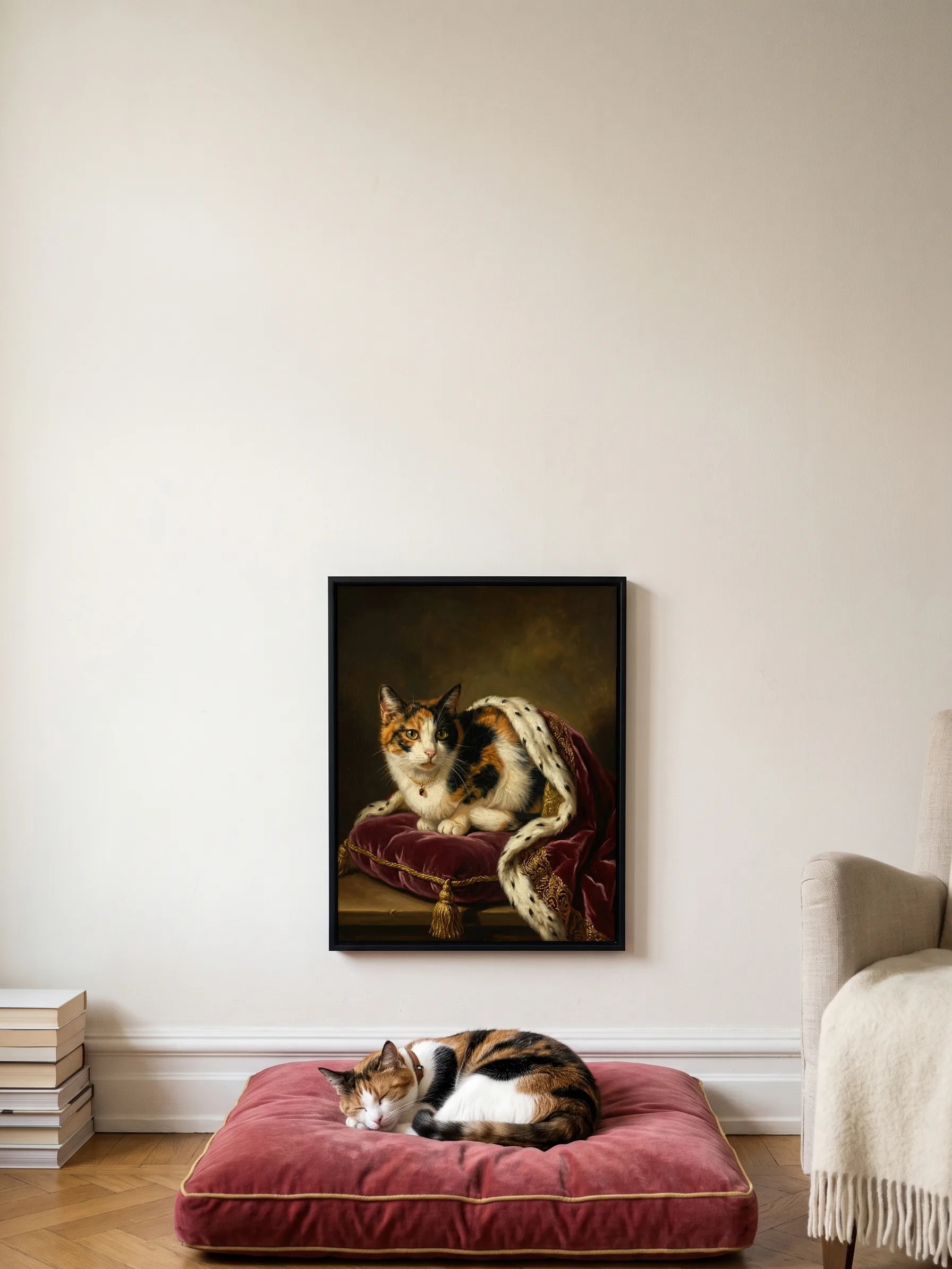 A calico cat asleep on a crimson velvet cushion under its own oil portrait, a framed canvas on the wall