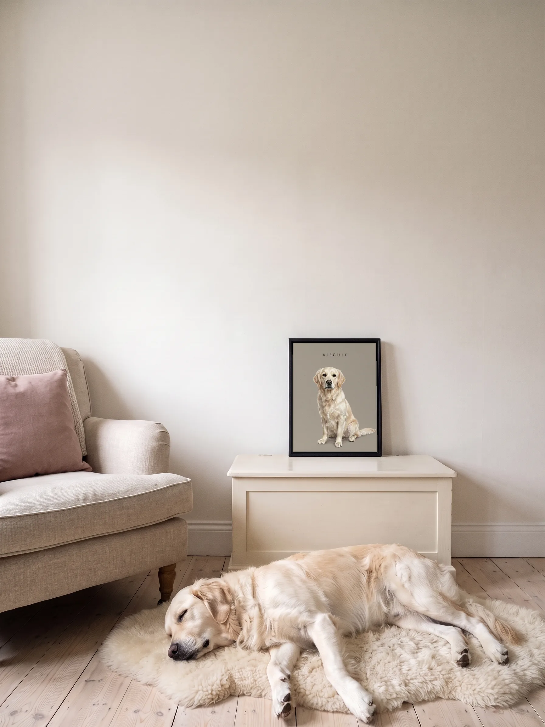 A golden retriever asleep on a sheepskin rug by a linen armchair; its own pastel portrait, a framed canvas, stands on a cream blanket chest