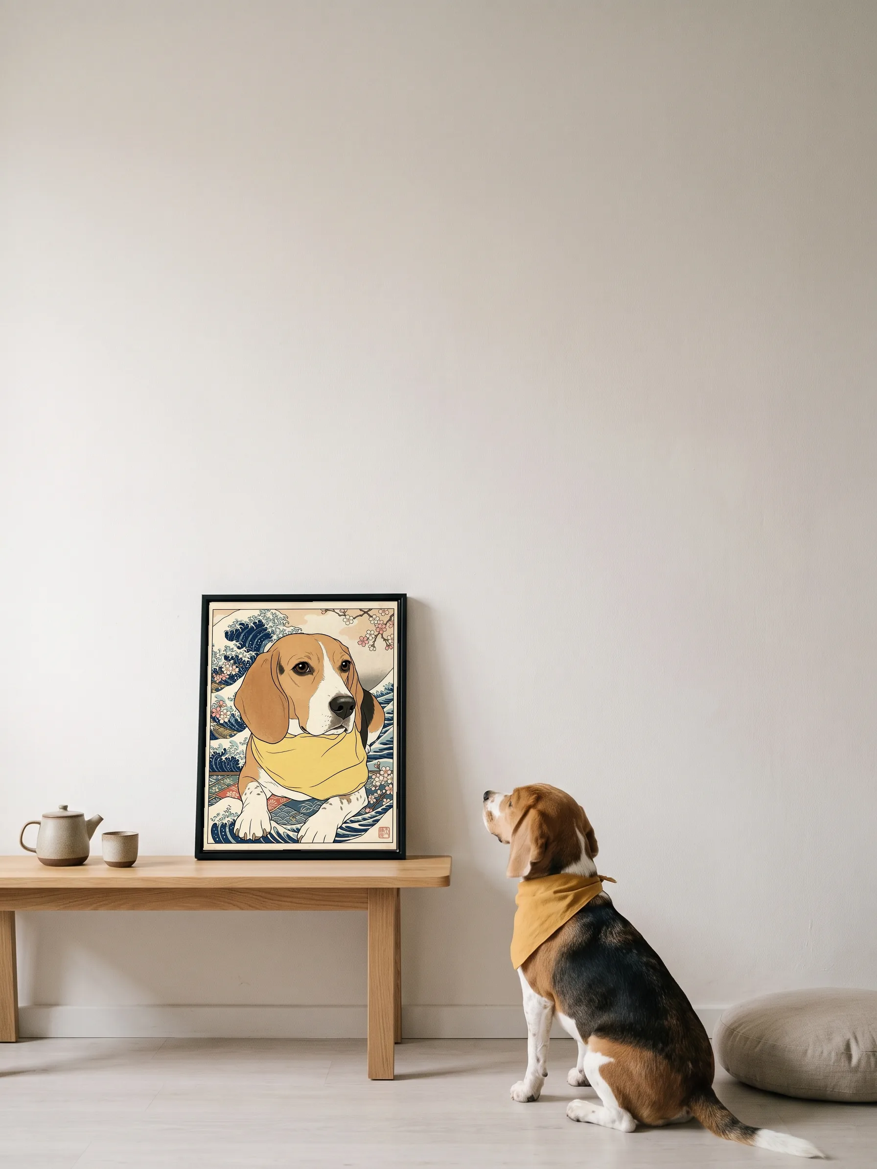 A beagle in a yellow bandana sitting on pale floorboards, looking up at its own woodblock-style portrait: a framed canvas on a low oak bench