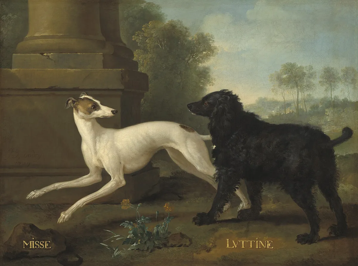 A white greyhound and a black long-haired dog before a stone column base, their names painted in gold below them